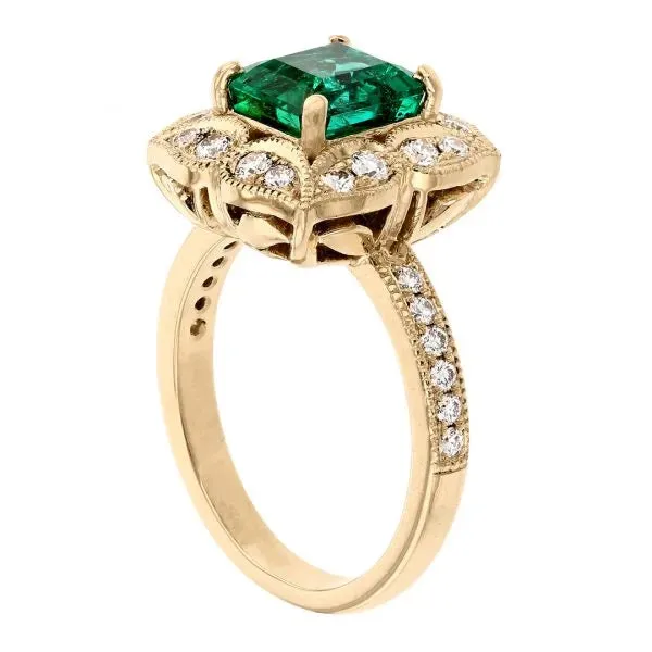 Antique emerald ring with floral diamond halo