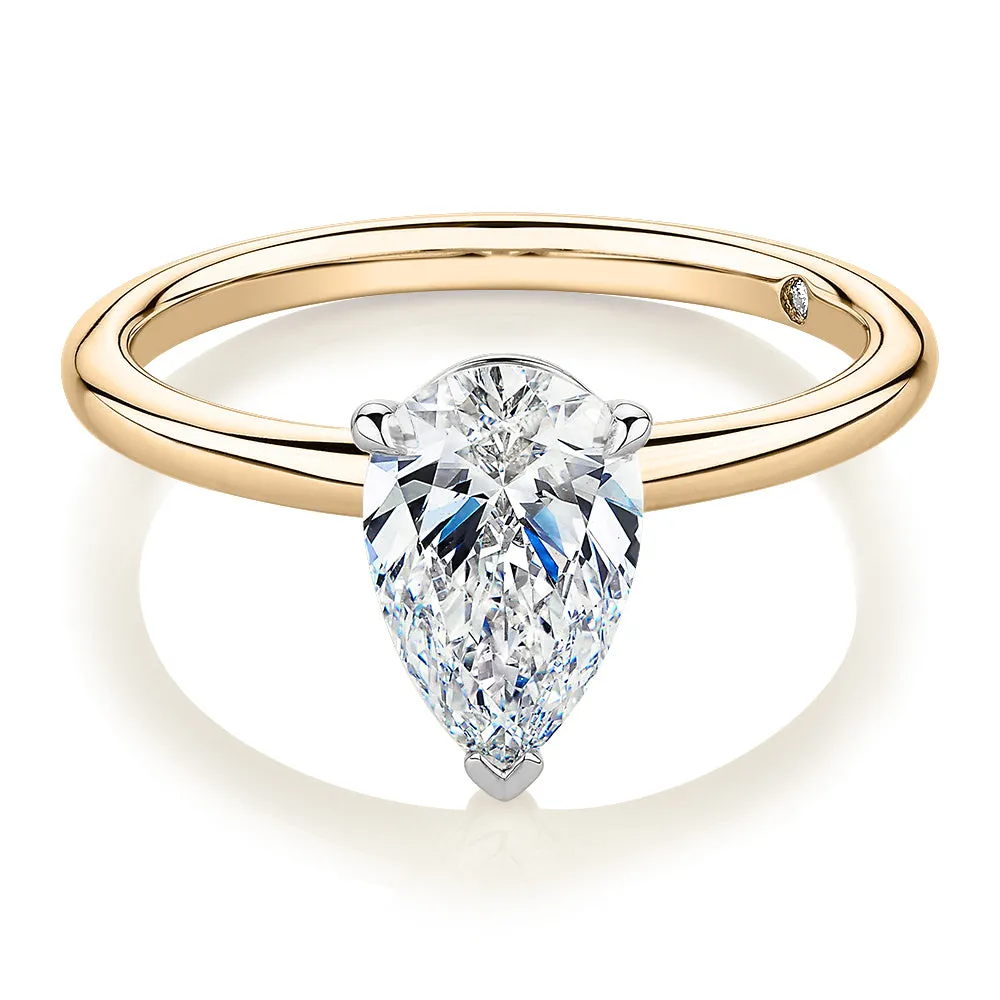 Signature Simulant Diamond 1.50 carat* pear solitaire engagement ring in 14 carat yellow and white gold